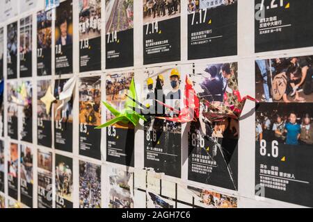 HongKong - November, 2019: Flyers, pictures and origami cranes on Lennon Wall in Hongkong  during the 2019 HongKong protests Stock Photo