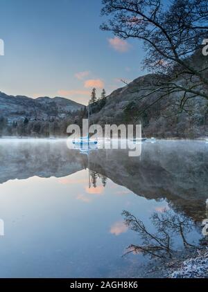 Hoar frost and dawn light over Ullswater at Glenridding, The English Lake District. Stock Photo