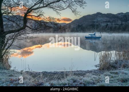 Hoar frost and dawn light over Ullswater at Glenridding, The English Lake District. Stock Photo