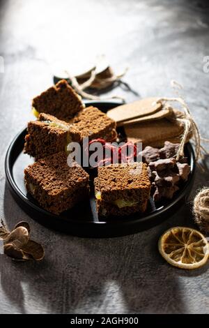 Sweet dessert delicious gingerbread cake.Healthy food and drink.Dried fruits Stock Photo