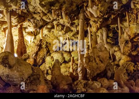 Various calcified formations, including stalactites and stalagmites, in a cave underground in Gozo island, Malta. Stock Photo