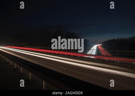 Light trails of moving cars on the motorway Stock Photo