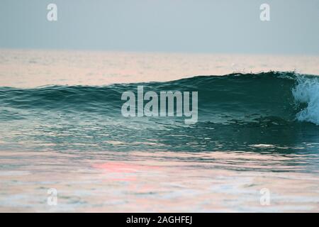 Collapsing turquoise blue wave in arabian Sea beach goa india Stock Photo