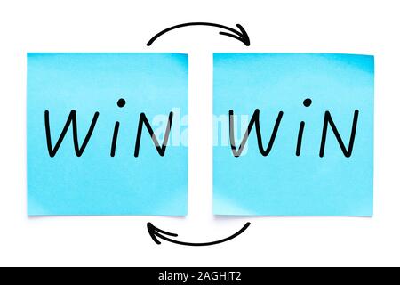 Handwritten Win-Win strategy or situation concept on two blue sticky notes on white background. Stock Photo