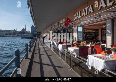 The Galata Bridge and The Yeni Cami Mosque in Istanbul, Turkey Stock Photo
