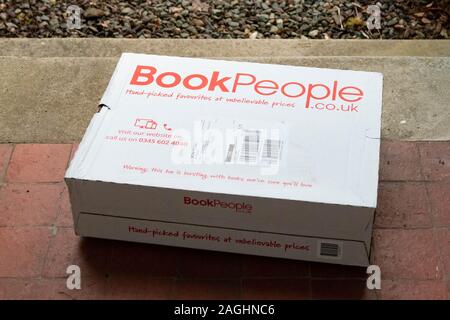Book People parcel on doorstep (delivery address removed) - UK Stock Photo