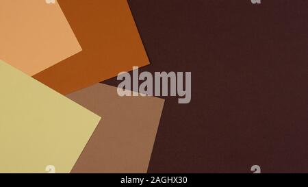 Abstract geometric paper background in earth tone. Many earth tones originate from clay earth pigments, such as umber, ochre, and sienna. Stock Photo