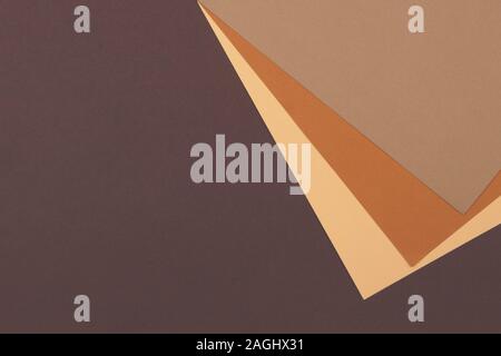 Abstract geometric paper background in earth tone. Many earth tones originate from clay earth pigments, such as umber, ochre, and sienna. Stock Photo