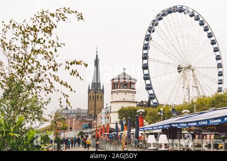 25 October 2018 Germany, Dusseldorf. North Rhine. City center, the embankment of the river. Saray Town Hall and the Ferris Wheel in the fall in Stock Photo
