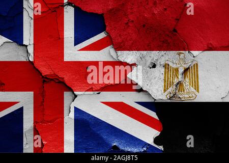 flags of UK and Egypt painted on cracked wall Stock Photo