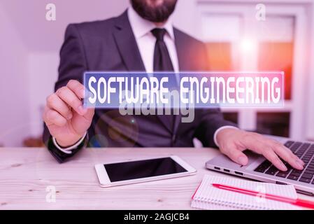 Writing note showing Software Engineering. Business concept for apply engineering to the development of software Male human wear formal clothes presen Stock Photo