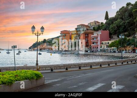 A colorful sunset on the Cote d'Azure at the seaside town of Villefranche Sur Mer, France, on the French Riviera. Stock Photo
