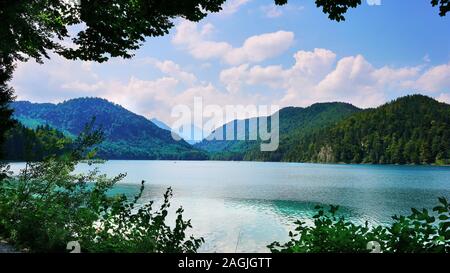 Landscape wide angle view of the famous Alpsee near Mad King Ludwig's fairy tale castle near the Alps Mountains in Southern Bavaria, Germany. Stock Photo