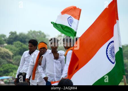 NAGPUR, MAHARASHTRA, INDIA, AUGUST - 15 : Unidentified people celebrating Independence Day by dancing and waving Indian flag (tri-colour) at futala la Stock Photo