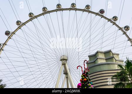 The upper part of Las Vegas Observation Wheel, High Roller with Christmas decorations in foreground - Las Vegas, Nevada, USA - December, 2019 Stock Photo