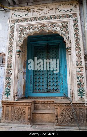 Decorative doorway and doorframe, with plants, in Old Delhi India near Chandi Chowk road Stock Photo