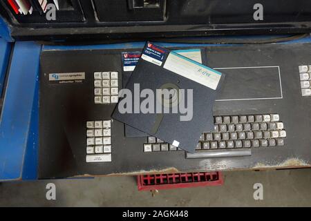 Old 80's style computer keyboard and floppy disk Stock Photo