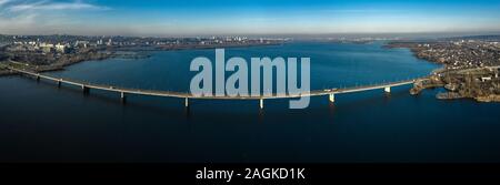 Aerial panoramic view on the South bridge across the Dnieper river in Dnipro city. Stock Photo