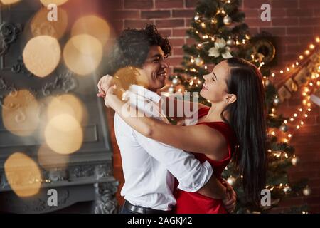 Having good time. New Year's evening dancing. Lovely gorgeous couple spending time together Stock Photo