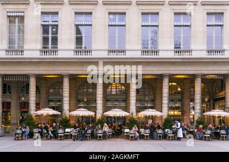 Paris Le Nemours - patrons having drinks at Le Nemours cafe bar in Place Colette in the 1st arrondissement of Paris, France, Europe. Stock Photo