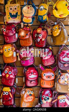 Yangshuo, China - August 2019 : Cute toy souvenirs for sale souvenir shops in the centre of Yangshuo old town, Guangxi Province Stock Photo
