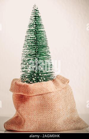 Zero Waste Christmas. Christmas tree in reusable bag, vintage style. Stock Photo