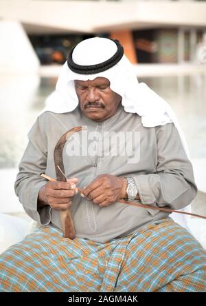 Abu Dhabi, 14th Deceber 2019: fisherman weaving a basket for catching grabs Stock Photo