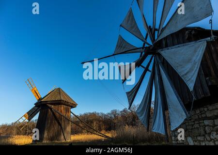 Autumn panorama with windmills on lake, Astra Museum of Traditional Folk Civilization, Sibiu city, Romania Stock Photo
