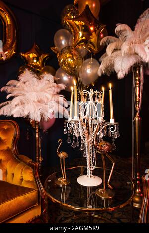 Crazy luxury corporate event decoration with feather and gold in Eastern Europe Latvia Riga bar cafe restaurant Stock Photo