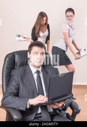 Businessman with laptop works in office Stock Photo