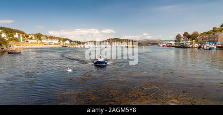 Argyll, Scotland, UK - June 3, 2011: Small hovercrafts arrive into the harbour at Tarbert on Loch Fyne in Argyll in the West Highlands of Scotland. Stock Photo