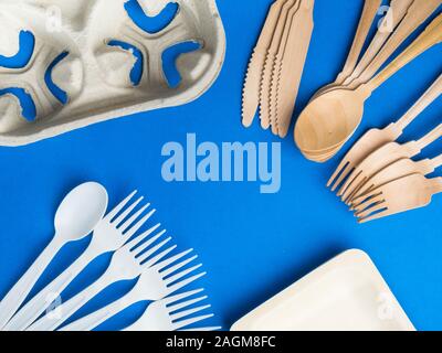 Eco-friendly biodegradable paper dishes on a blue background Stock Photo