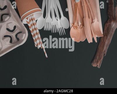 Flat lay with eco - friendly tableware on dark background, space for text Stock Photo