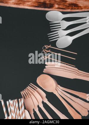 Flat lay with eco - friendly tableware on dark background, space for text Stock Photo