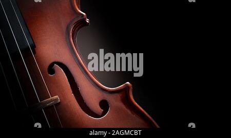 Violin body in the dark with isolated black background. Horizontal panoramic composition. Stock Photo