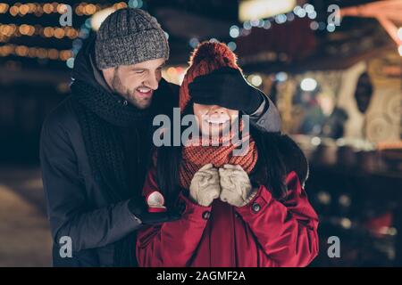 Marry me. Portrait of his he her she nice attractive charming lovely cheerful cheery couple wearing warm outfit guy making proposal giving engagement Stock Photo