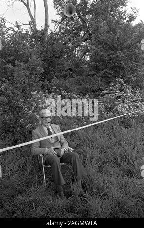 Cowdray Park Polo Club 1980s. Man watching from the side line with loud speaker above him. 1981  UK HOMER SYKES Stock Photo