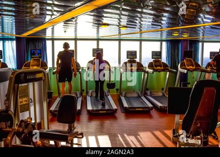 Half Moon Cay island, Bahamas - December 4, 2019: People training at gym at Holland America cruise ship Eurodam Stock Photo