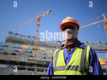 A construction worker at the Lusail Stadium in Lusail, Qatar. Stock Photo