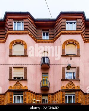 Budapest, Hungary, Aug 2019, view of the top part of a bicoloured building Stock Photo