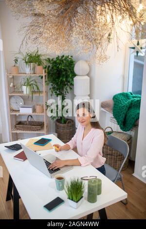 Top view of a young working woman Stock Photo