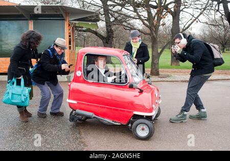 A Peel P50 the smallest car in the world is road tested around the streets and offices of Kensington. Stock Photo