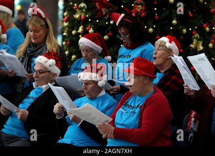 Members of Memory Lane Choir, a choir for older people that welcomes members living with dementia, during their Christmas carols recital at Busaras in Dublin. Stock Photo