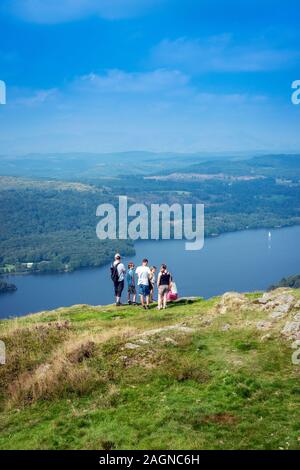 group of hikers looking down on Lake Windermere from Gummer's How, lake district, cumbria,england,uk Stock Photo