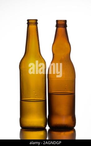 Empty glass bottles that can be used for different drinks. Stock Photo