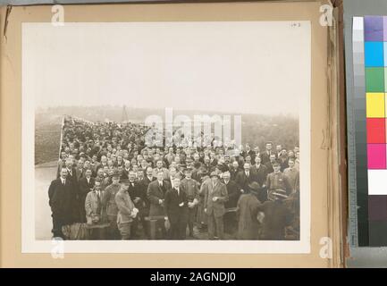 A collection of separate photographs accompanied by a typewritten, classified list of titles. Acc. Hdq. R. 480; Organization. Ashokan reservoir. Group of visitors on top of Olive Bridge dam at celebration of the storag of water in Ashokan reservoir. Contract 3. October 11, 1913. Stock Photo