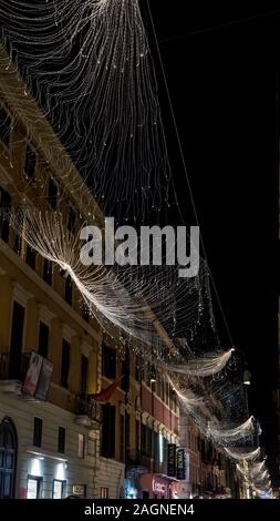 Rome 2019. Christmas decorations with screens that broadcast clips from films from the golden age of Italian cinema. December 2019 in Rome. Stock Photo
