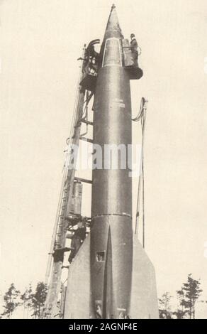 A German V2 rocket being prepared for launching. World War 2 1954 old print Stock Photo