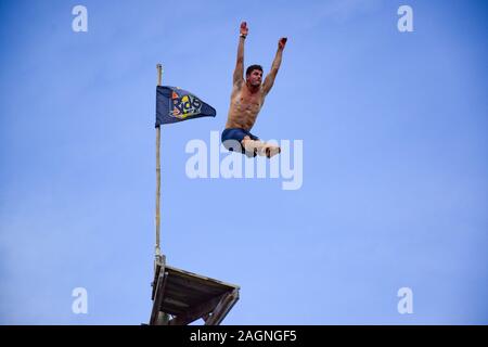 NEGRIL, JAMAICA - Aug 05, 2016: Ricks Café, Negril, Jamaica – August 2016: David Colturi Red bull cliff diver jumping off platform Stock Photo