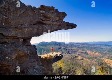 Halls Gap, VIC, Australia - January 28, 2008: Unidentified woman on rock formation in Grampians nationalpark named The Balconies Stock Photo